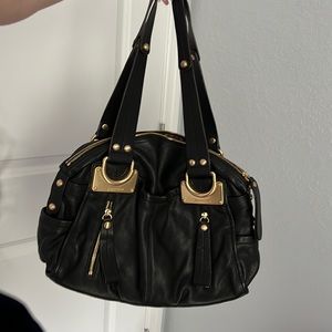 Black and gold B. Mankowsky designer purse with multiple pockets and zippers
